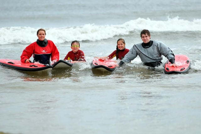 Lifeguards Jess Errington and Sean Kelly with Golden Flatts Primary school pupils Graham Lightfoot and Nicole Croft in the sea at Seaton Carew. Does this 2011 scene bring back memories?