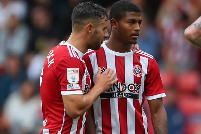 George Baldock talks to Rhian Brewster (R): Simon Bellis / Sportimage
