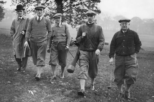 Herbert Chapman, right, plays a round of golf with Arsenal's Tom Parker (left to right), Alec James and David Jack on 14th November 1929.
