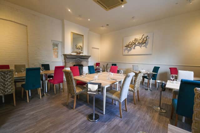 One of the two available dining rooms at Neon Fish