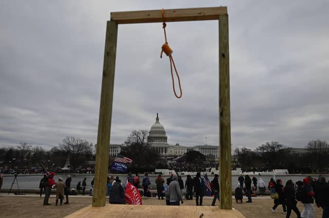 Supporters of US President Donald Trump gather on the West side of the US Capitol in Washington DC on January 6, 2021. - Demonstrators breeched security and entered the Capitol as Congress debated the a 2020 presidential election Electoral Vote Certification. (Photo by ANDREW CABALLERO-REYNOLDS / AFP)