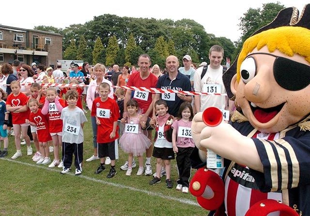 Captain Blade gets ready to set the kids off on the British Heart Foundation's fundraising mini marathon, part of their 'Jog for June' at Graves Park, Sheffield, June 18, 2006