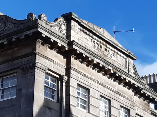 Carved into the stonework above the police station at Constitution Street are the words "TOWN HALL". Built in 1828 (Leith became an independent burgh in 1833) this was the original Leith Town Hall. The building still contains the old Victorian debating chamber within.