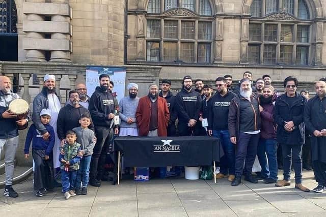 Hundreds of people were handed free flowers and chocolate in Sheffield city centre – as the city’s Muslim community celebrated Mawlid. Pictured are volunteers on the steps of the town hall