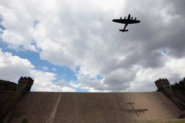 A Lancaster bomber flies over Ladybower reservoir to mark the 70th anniversary of the World War II Dambusters mission on May 16, 2013. (Photo by Christopher Furlong/Getty Images)
