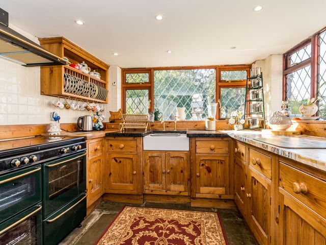 The kitchen has a large cooker.