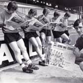 Absorbed in reading The Star souvenir depicting their 1971 promotion success are Sheffield United led by skipper Eddie Colquhoun, who the club have announced has sadly passed away