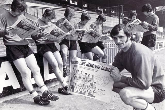 Absorbed in reading The Star souvenir depicting their 1971 promotion success are Sheffield United led by skipper Eddie Colquhoun, who the club have announced has sadly passed away