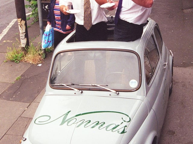 Pictured at Nonna's Deli, Ecclesall Road, Sheffield, where partners Maurizio Mori and Gian Bohan are seen in their original Fiat 500 Cinquecento 1969 bubble car, June 1999.