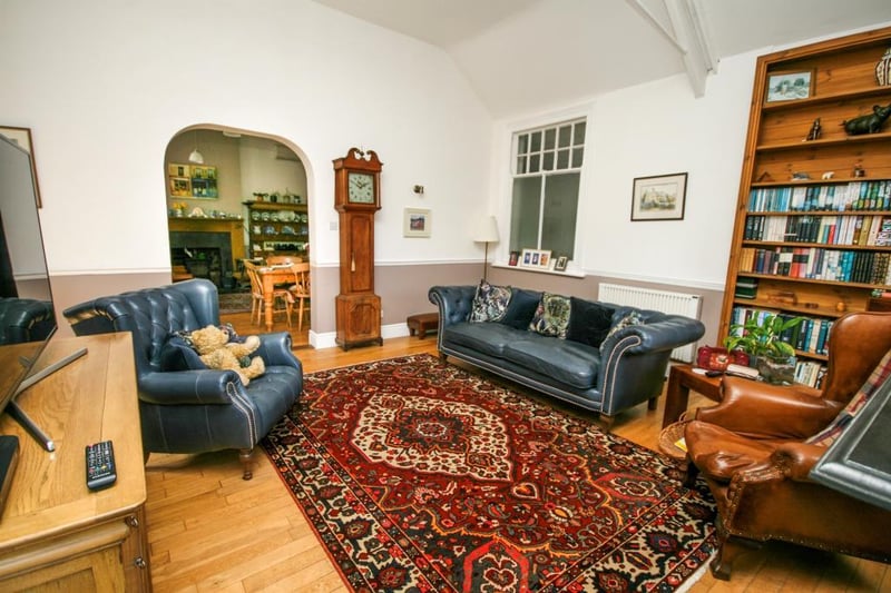 A spacious lounge having high ceilings, feature cast iron open fireplace with a tiled hearth, two newly fitted German electronic thermostatic controlled radiators and open archway through to the farmhouse-style kitchen.