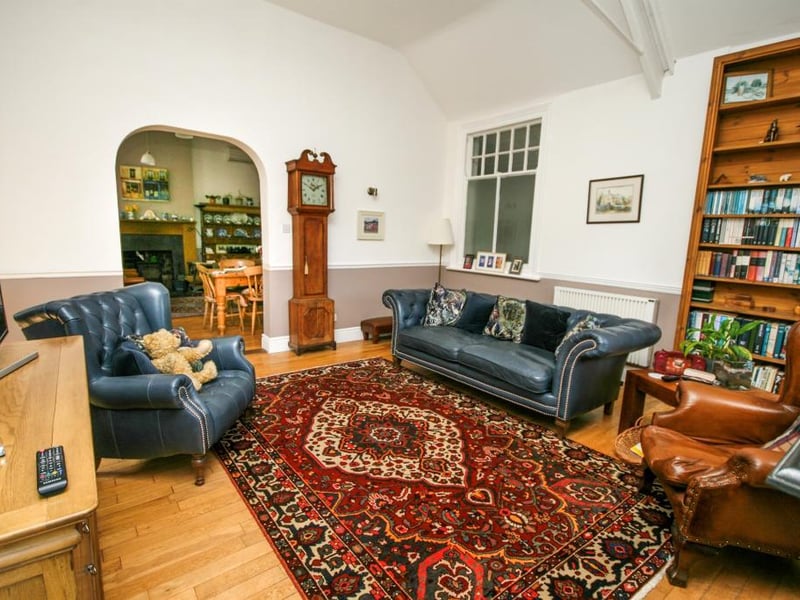 A spacious lounge having high ceilings, feature cast iron open fireplace with a tiled hearth, two newly fitted German electronic thermostatic controlled radiators and open archway through to the farmhouse-style kitchen.