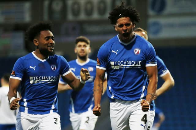 Josef Yarney celebrates with teammates after he scores Chesterfield's third goal against King's Lynn Town.