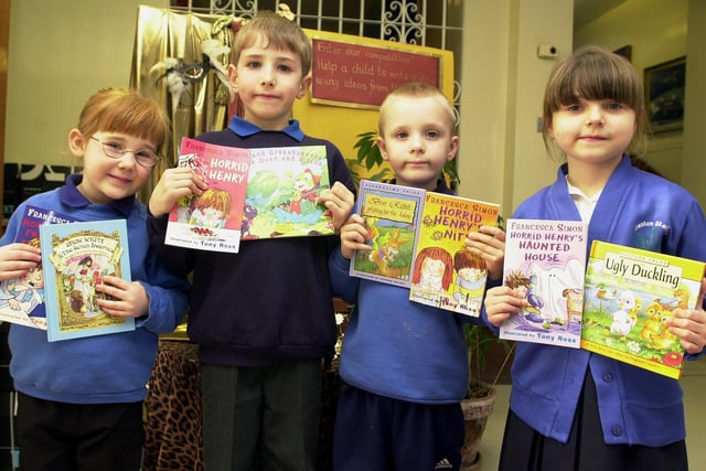 Owston Skellow Infant School pupils, from left, Katie Parsons, aged five, Adam Crowe, aged seven, Corey Vickers, aged five, and Katie Biela, aged six, are pictured with their prize books in February 2001