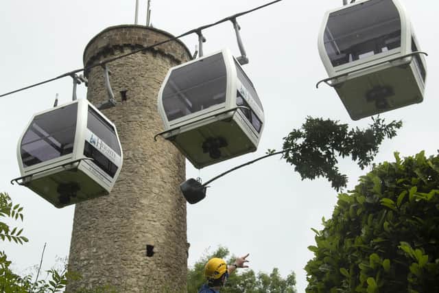 Cable cars at Matlock Bath. In this picture, they were used to haul a five metre long sapling which was too tall to be driven up the snaking pathways, to the 60 acre hilltop park.