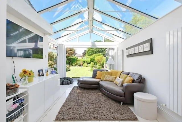 The family room has bi-folding doors to the side and rear onto a block-paved patio, designer radiators, a tiled floor with under-floor heating and a glass roof.