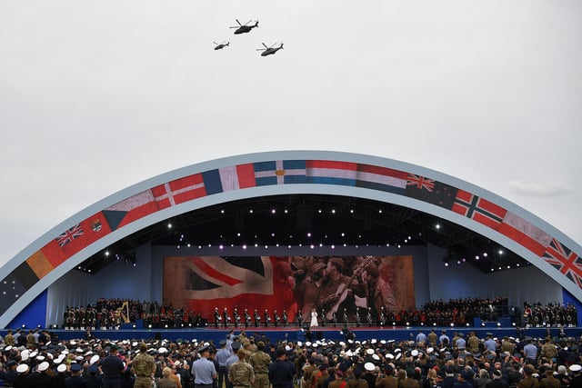Helicopters fly over the stage as Sheridan Smith sings during the D-Day 75 event on Southsea Common