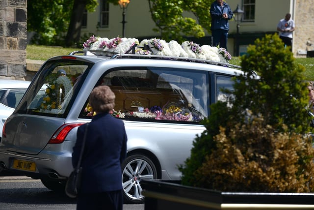 Sheila was surrounded by flowers as she was taken to St Michael's and All Saints.