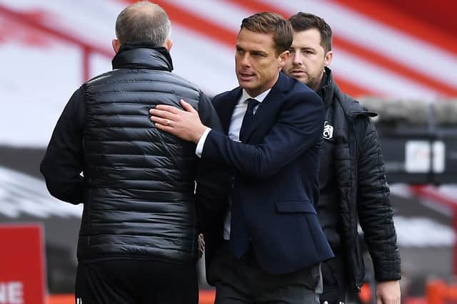Chris Wilder, manager of Sheffield United shakes hands with Scott Parker, manager of Fulham following the Premier League match (Photo by Gareth Copley/Getty Images)