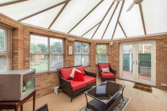 Conservatory - A spacious third reception room with four rear facing double glazed windows, providing a beautiful outlook onto the generous rear garden. There are side facing French doors which lead to the decking and patio area. There is a central heating radiator.