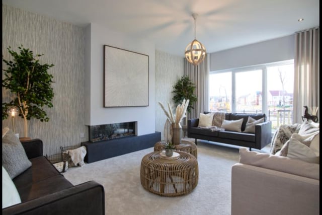 The family lounge with its ultra-stylish living flame fire.
Image by Robertson Homes.