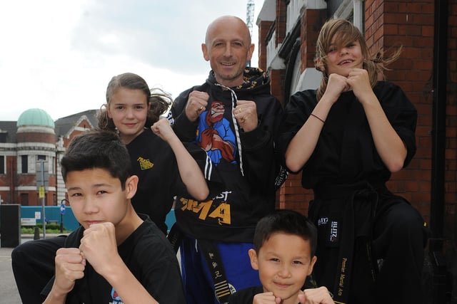 Danny, 13, and Brandon Chung, 9 and Lauran Renwick, 11, Stuart Wilks and Shannon Mann, 13, all from East West Mixed Martial Arts Group, performed at the British Red Cross Fashion Show in 2011