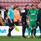 Sheffield United manager Paul Heckingbottom drags Wes Foderingham away following the melee which followed the draw with Blackpool: Simon Bellis / Sportimage