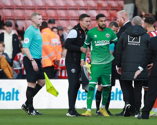 Sheffield United manager Paul Heckingbottom drags Wes Foderingham away following the melee which followed the draw with Blackpool: Simon Bellis / Sportimage