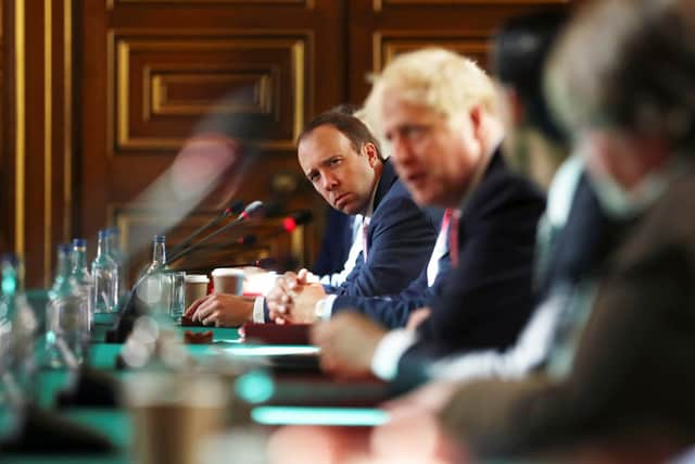 Health Secretary Matt Hancock looks on as Prime Minister Boris Johnson chairs a face-to-face meeting of his cabinet team of ministers (Photo by Simon Dawson - WPA Pool/Getty Images)