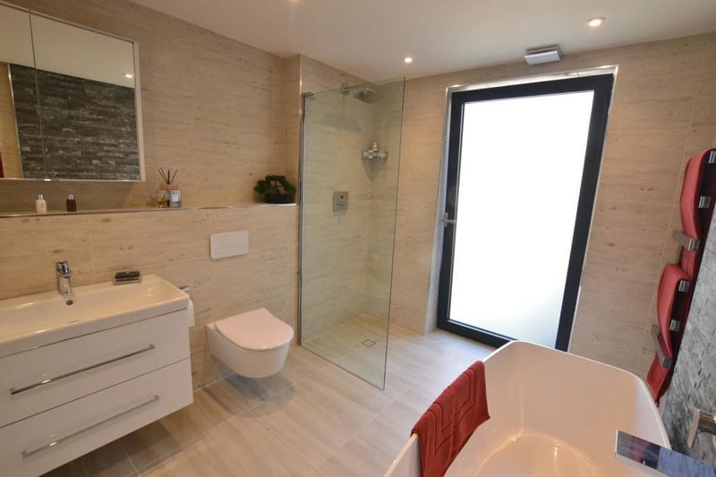 One of three bathrooms, this property is host to grand light rooms.