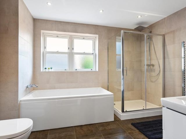 Villeroy and Boch products feature in all the bathrooms dotted around the house. This one features a shower cubicle, bath, low-flush WC and wash hand basin with vanity unit.