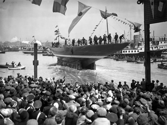 April 1934:  The launch of Tommy Sopwith's all-steel yacht Endeavour, this years challenger for the America's Cup, at Gosport, Hampshire.  (Photo by A. Hudson/Topical Press Agency/Getty Images)