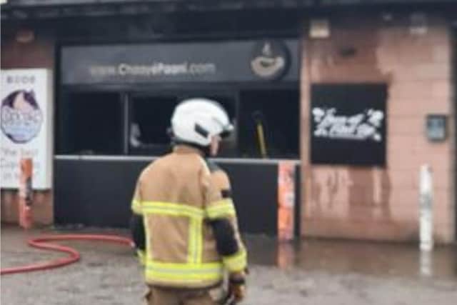 Bosses at a Sheffield takeaway devastated by fire yesterday hope to be back in business within days. PIcture shows a firefighter looking at the scene at Chaayé Paani, in Attercliffe, yesterday. Picture: Darren