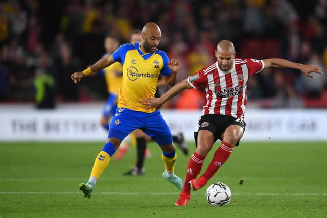 Adlene Guedioura of Sheffield United is put under pressure by Nathan Redmond of Southampton: Laurence Griffiths/Getty Images