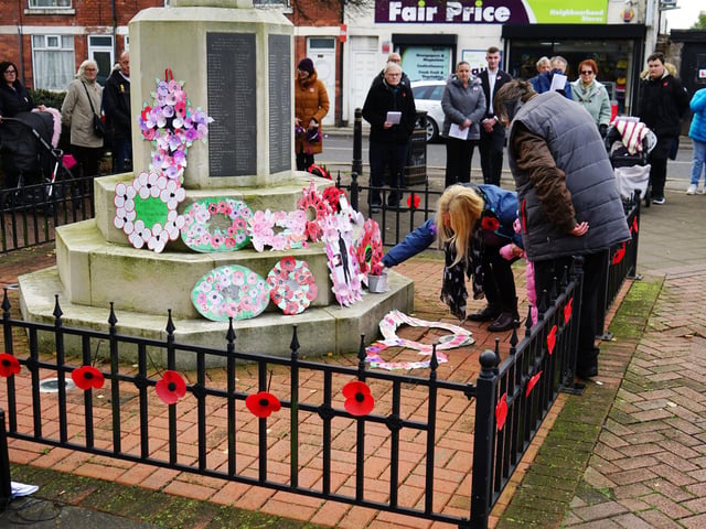 A number of local children attended the ceremony to pay their respects