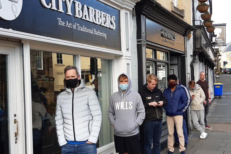 Early morning arrivals queuing at City Barbers.