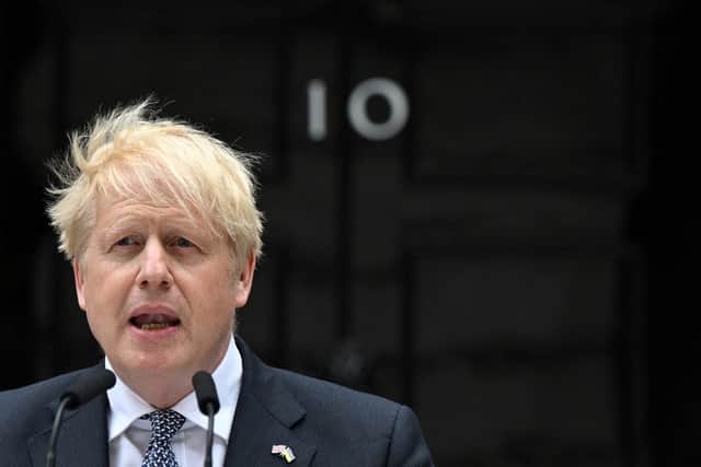 Britain's Prime Minister Boris Johnson makes a statement outside 10 Downing Street in central London on July 7, 2022. - Johnson quit as Conservative party leader, after three tumultuous years in charge marked by Brexit, Covid and mounting scandals. (Photo by JUSTIN TALLIS / AFP) (Photo by JUSTIN TALLIS/AFP via Getty Images)