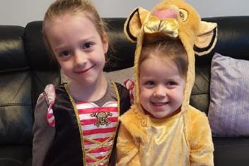 Amelia (l), 6 and (r) Hallie, 4, Risebrough dressed as a pirate and a lion for World Book Day.