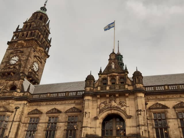 The Israel state flag flying over Sheffield Town Hall yesterday. It was later removed and replaced with a Palestine flag by protesters who climbed the building during a protest in solidarity with the people of Gaza. Picture: Julia Armstrong, LDRS