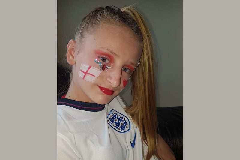Macie shows off her England-themed make-up.