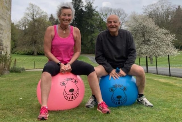 Joanna and Simon Hulme completed 26 laps of their garden on space hoppers for The 2.6 Challenge.