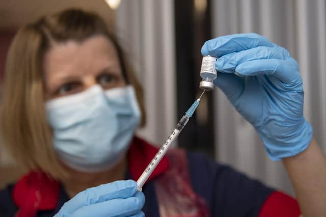 Nurses at the Northern General Hospital, Sheffield preparing vaccine doses.