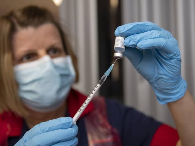 Nurses at the Northern General Hospital, Sheffield preparing vaccine doses.