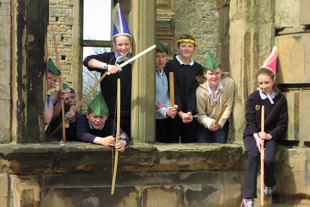 Children from Bolsover Primary School take part in a perfomance to open Tales of Robin Hood weekend at Bolsover Castle in 2003.