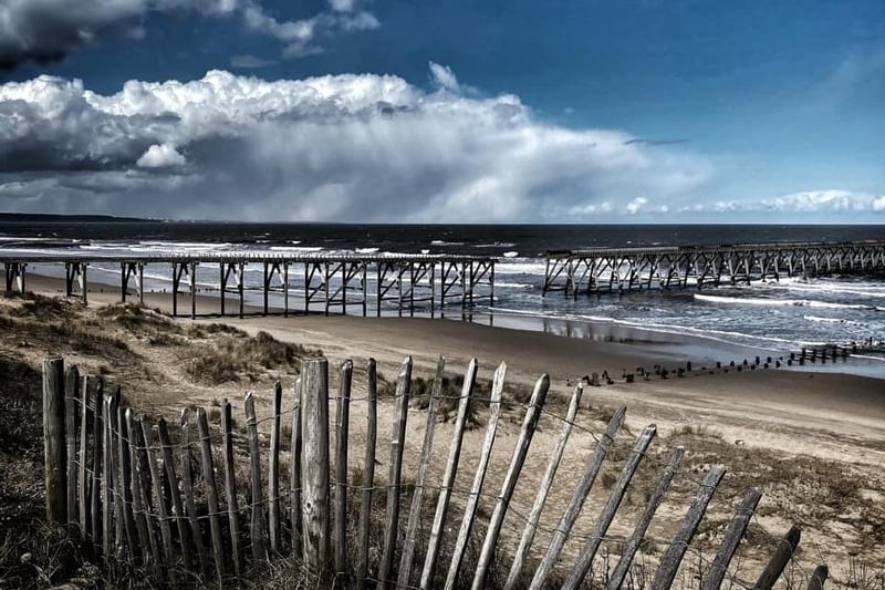 Clouds rolling in over the pier.