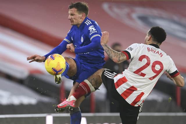 Leicester's Marc Albrighton, left, and Sheffield United's Kean Bryan vie for the ball (Laurence Griffiths, Pool via AP)