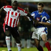 Sheffield United's Wayne Allison (left) shields the ball from Portsmouth's Gianluca Festa: Nick Potts.