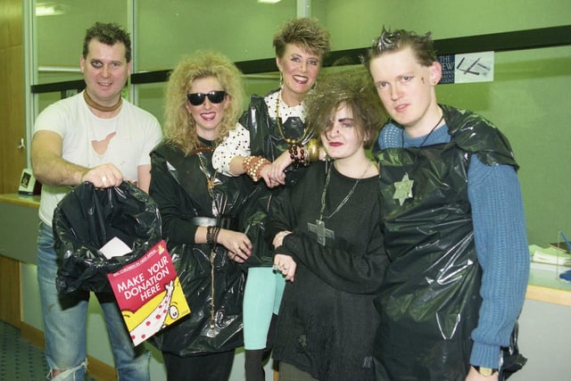 A Children in Need November 1991 photo showing Woolwich Building Society staff dressed as punks. Remember this?