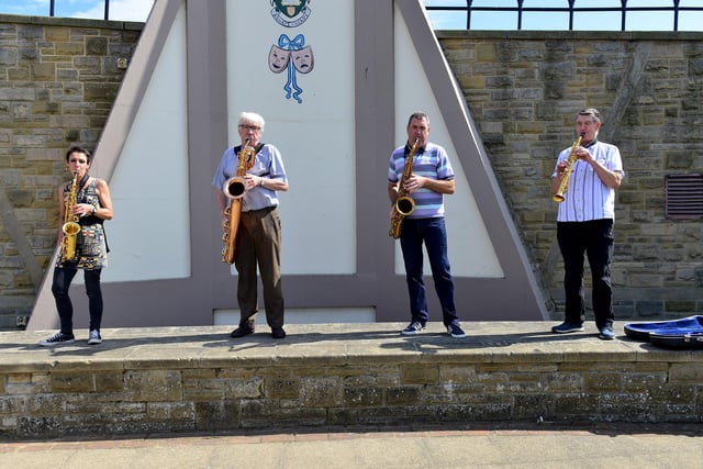 Jude Murphy, Paul Thompson, Grahame Dodd and Jim Charlton gather together to play in the sun.