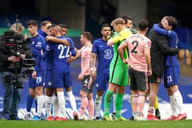 Chelsea and Sheffield United players hug after the final whistle: John Walton/PA Wire.