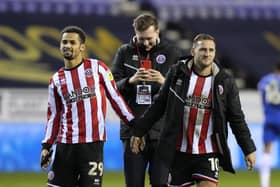 lliman Ndiaye and Billy Sharp celebrate Sheffield United's victory at Wigan Athletic: Andrew Yates / Sportimage